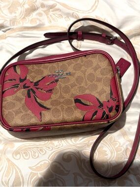 Coach Floral Bow Coated Canvas Crossbody in Brown and Pink